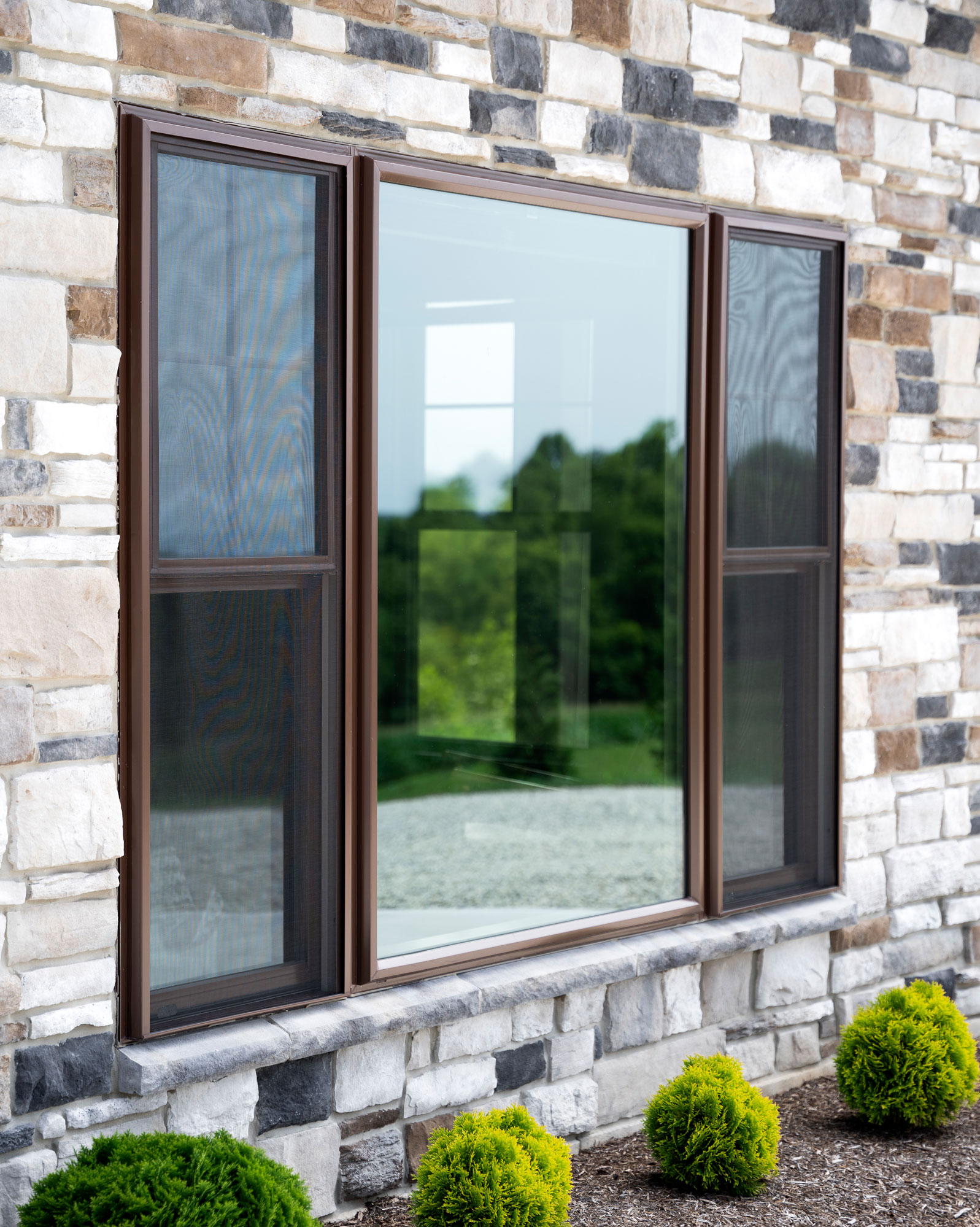 Endure™ Double Hung and Picture Windows in Tudor Brown with Cottage Grids