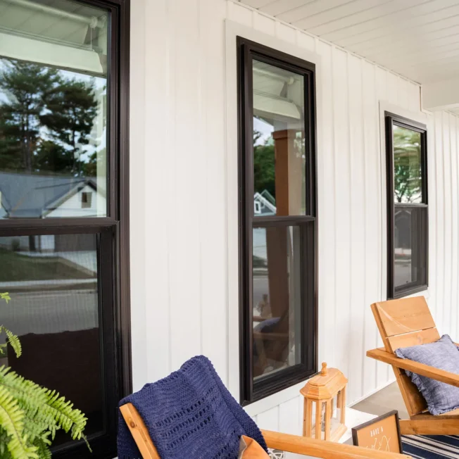 Endure™ Double Hung Windows in Textured Matte Coal Black on Front Porch